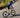 Cyclist climbing out of the saddle on Yoeleo carbon wheelset showing rotating mass benefit
