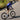 Cyclist climbing out of the saddle on Yoeleo carbon wheelset showing rotating mass benefit