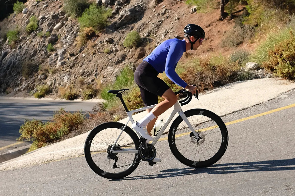 Rider using a deep width wheels on steep climb